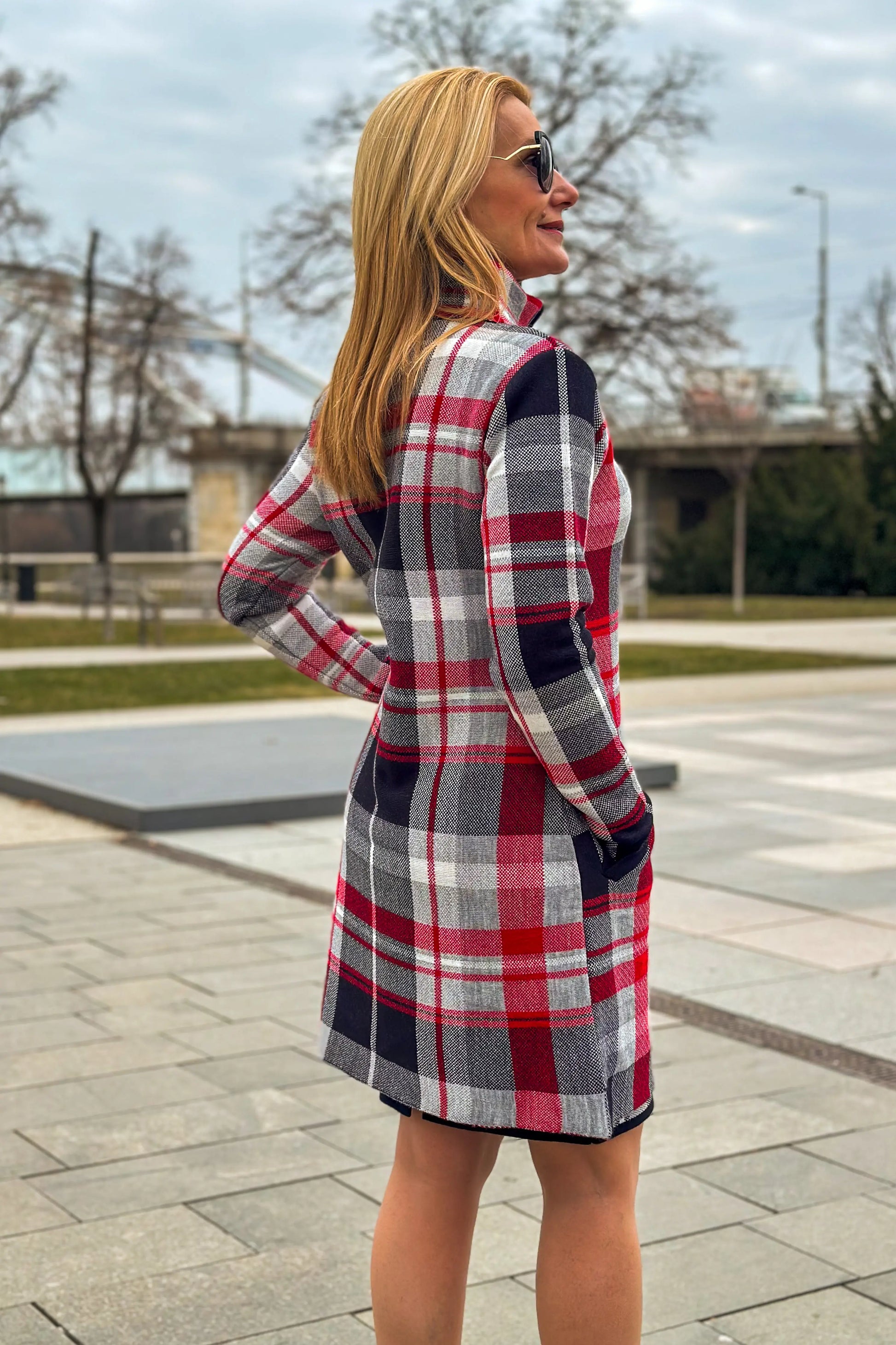 Side view of Ajsa red and black plaid coat