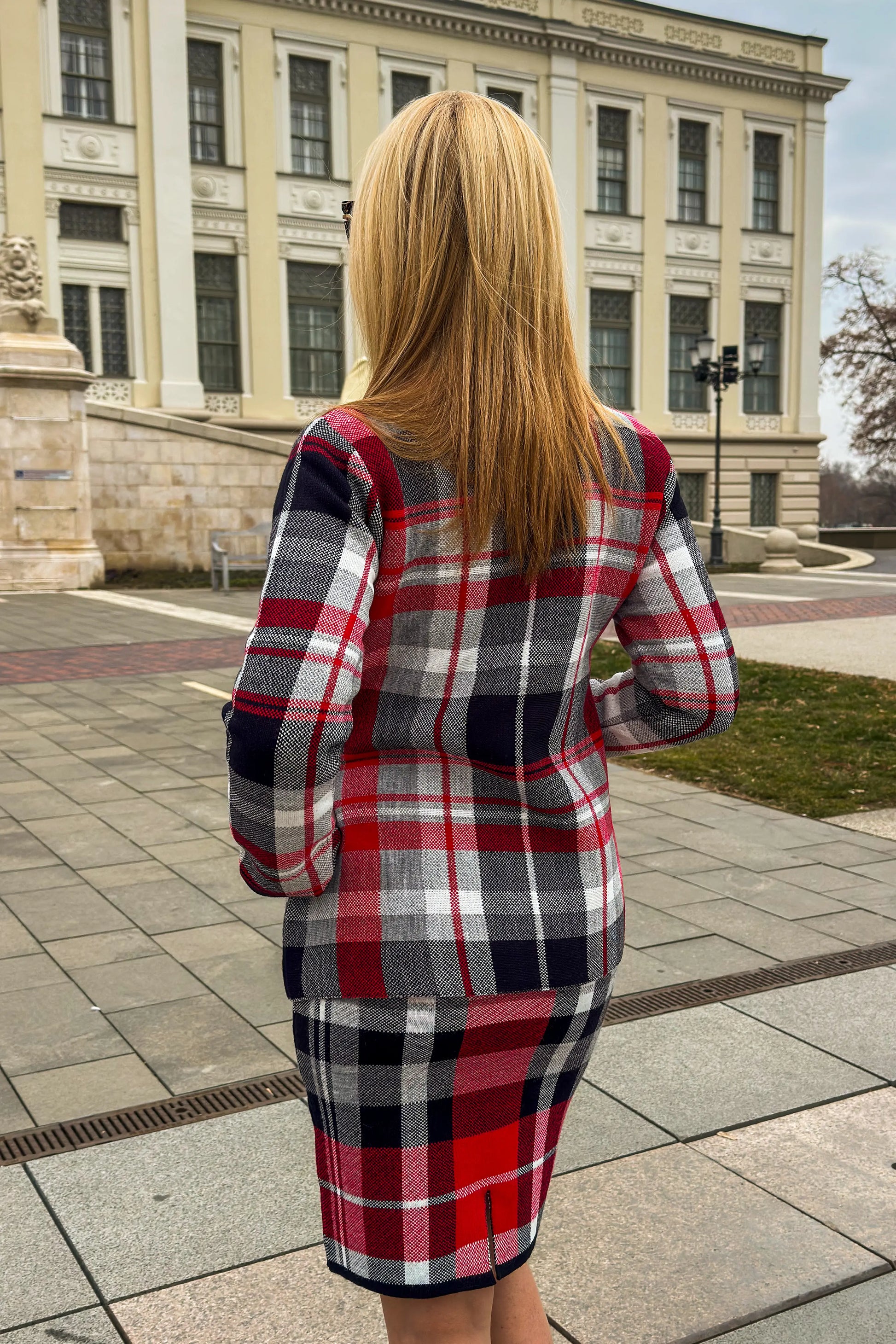 High-neck plaid coat in a deep red shade, perfect for cold days.