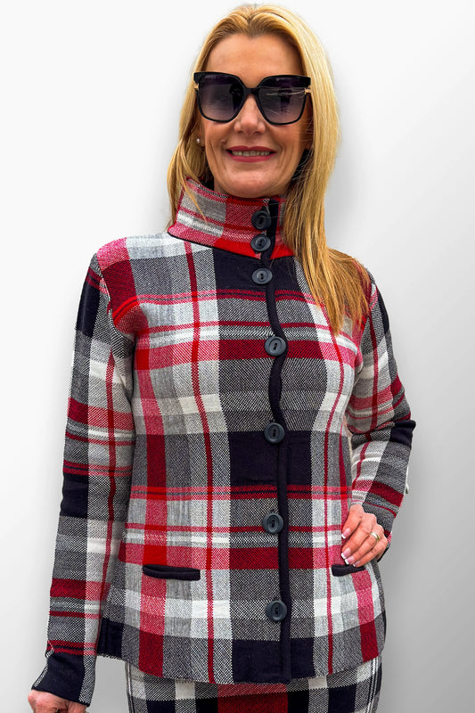 Woman in a soft black and red plaid short coat with a high buttoned neck.