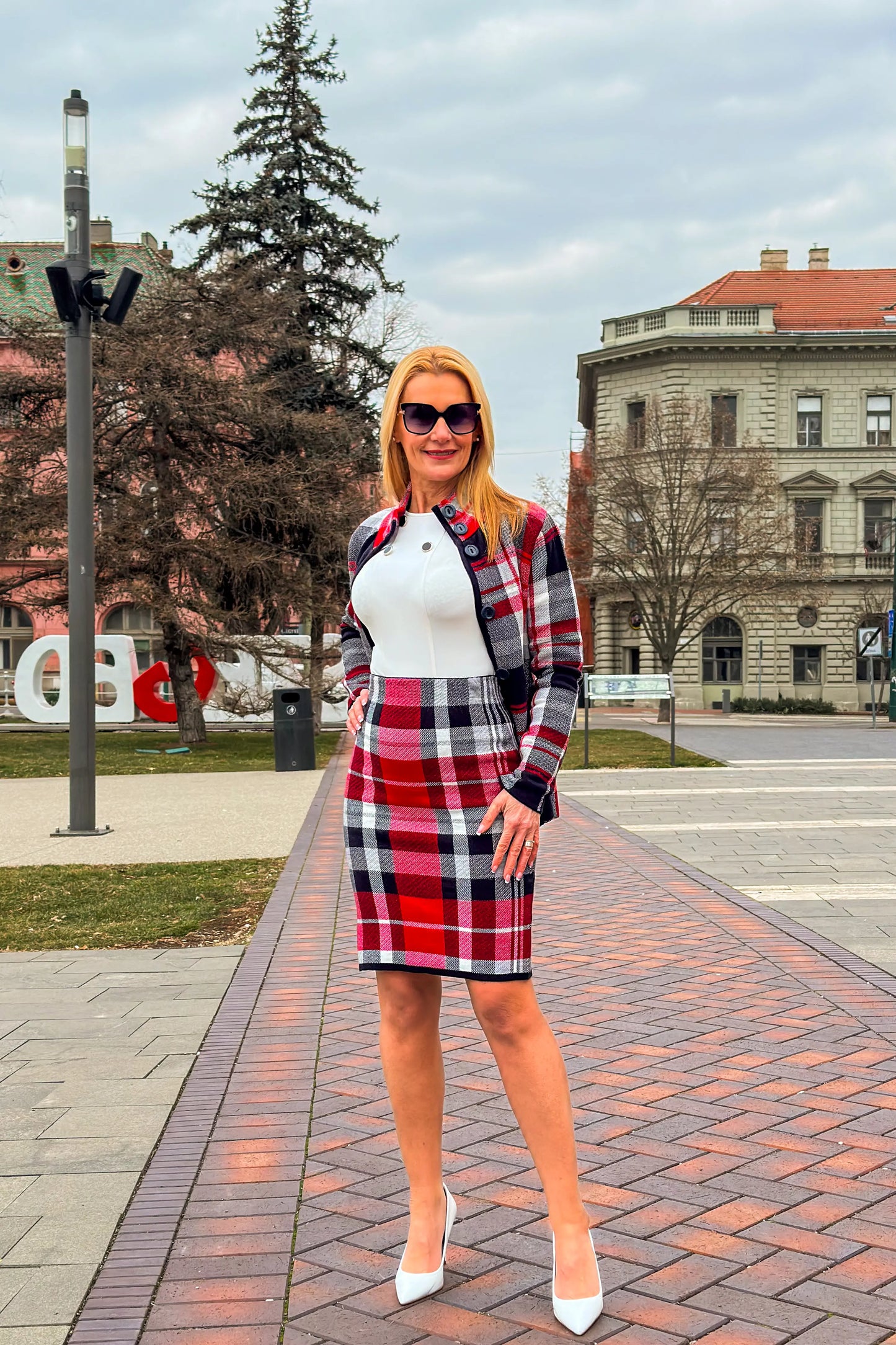 Aniko High-Waisted Plaid Midi Skirt - side view showing plaid pattern.