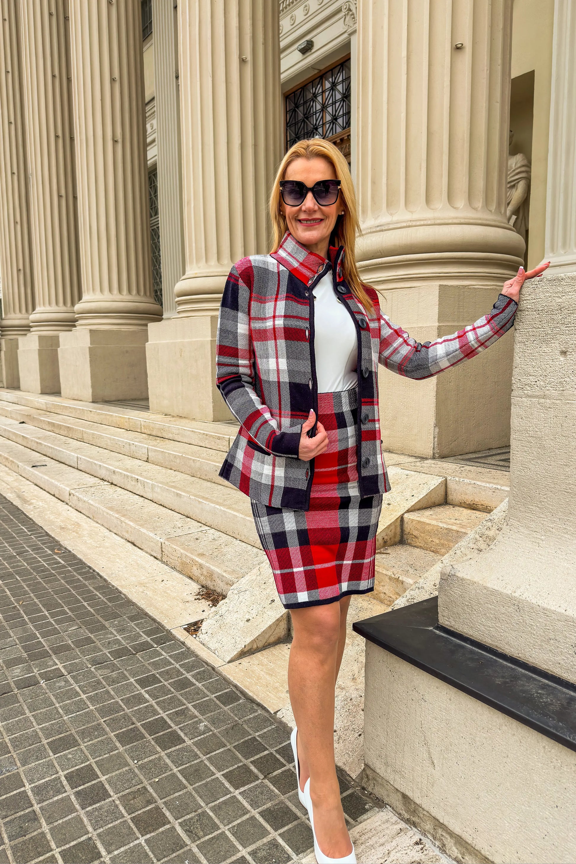 side view of Aniko plaid midi skirt with matching short coat in red