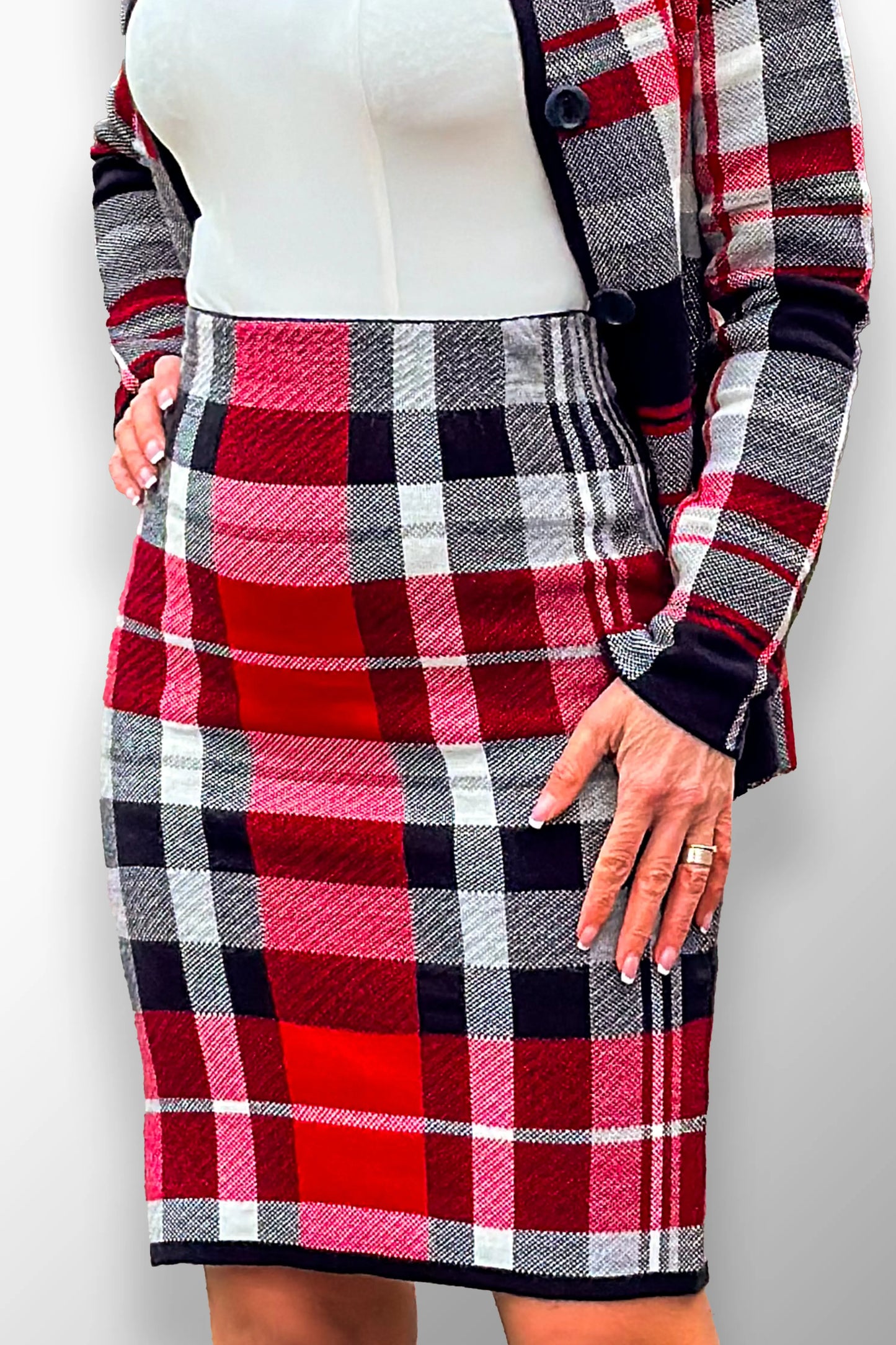 Aniko High-Waisted Plaid Midi Skirt - Close-up of plaid texture and fabric.