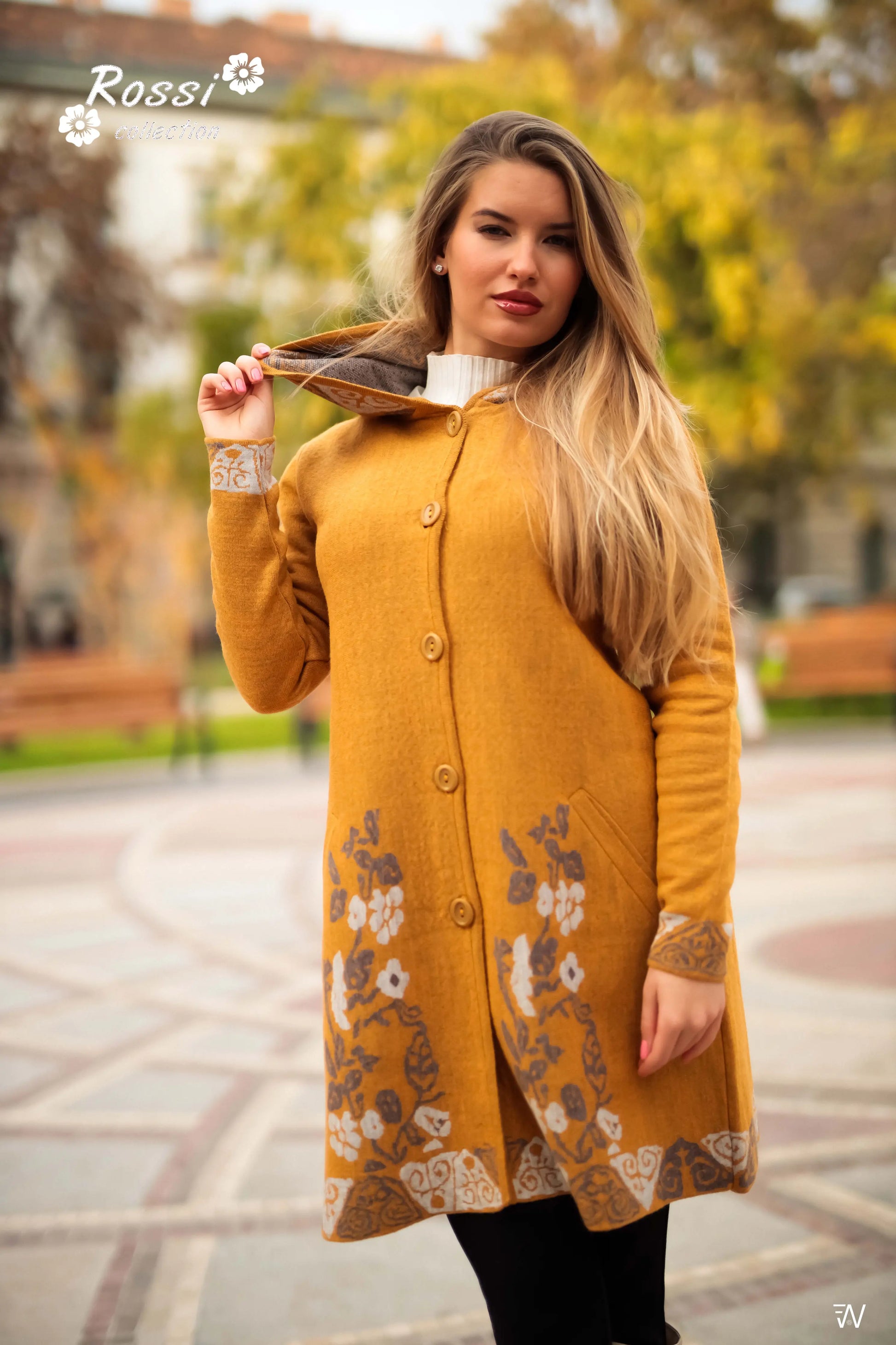 Close-up of Anita coat’s deep pockets and floral accents.