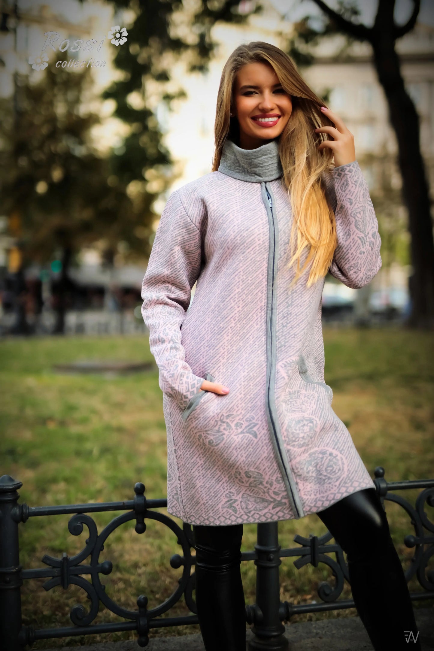 Soft wool-blend coat with stylish pink accents.