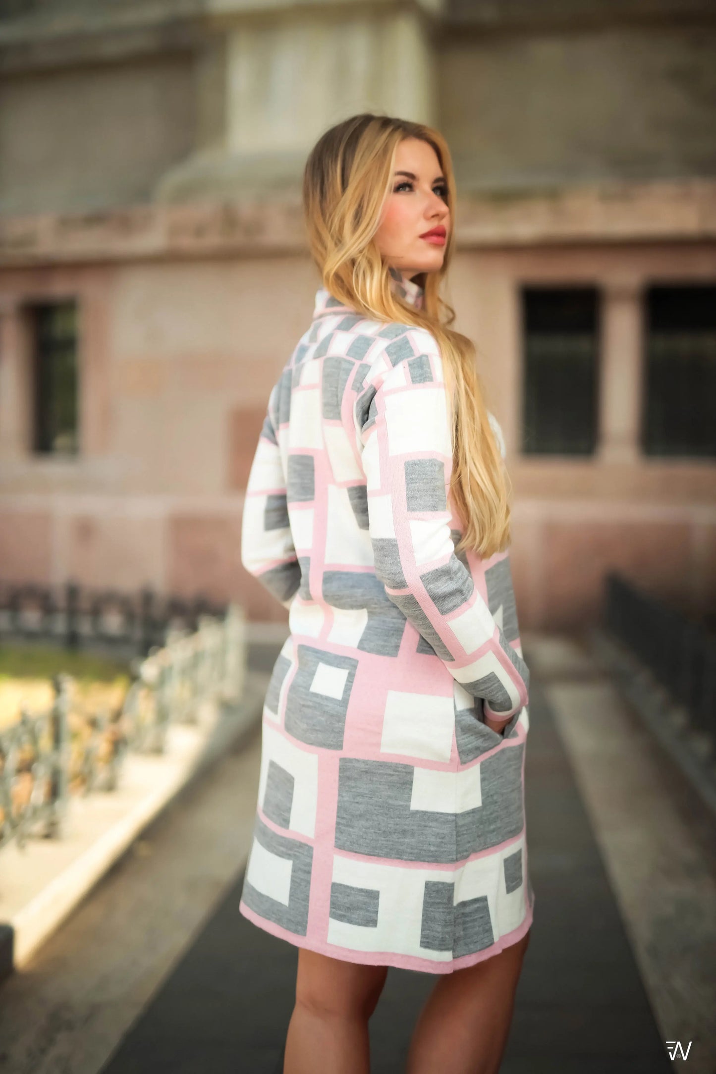 Chic pink wool-blend coat for sophisticated outings.