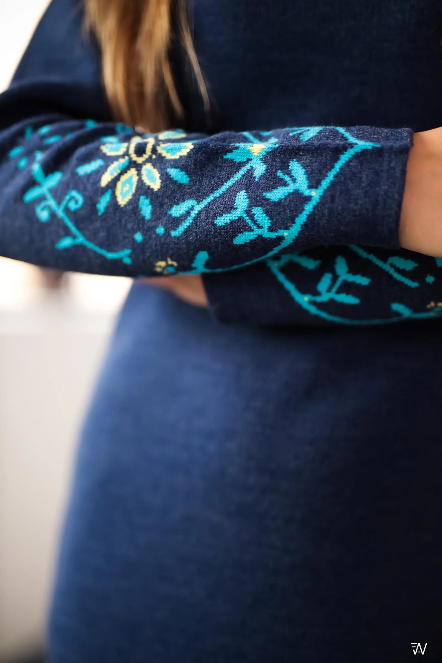 Close-up of floral detail on Natalia knit dress.