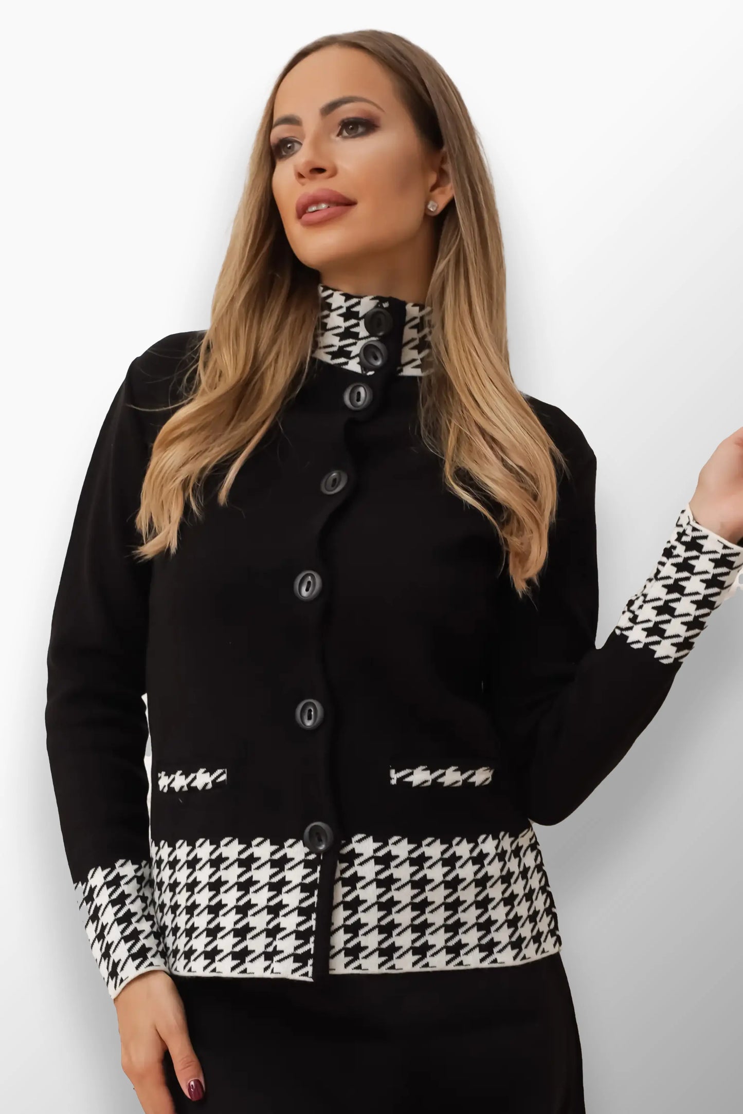 Model in a classic checkered short coat with buttoned front and pocket details.