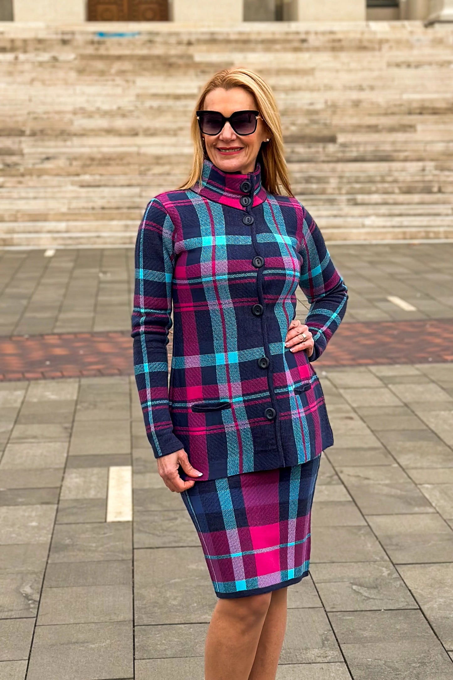 timea navy and pink plaid short coat with high heels and sunglasses