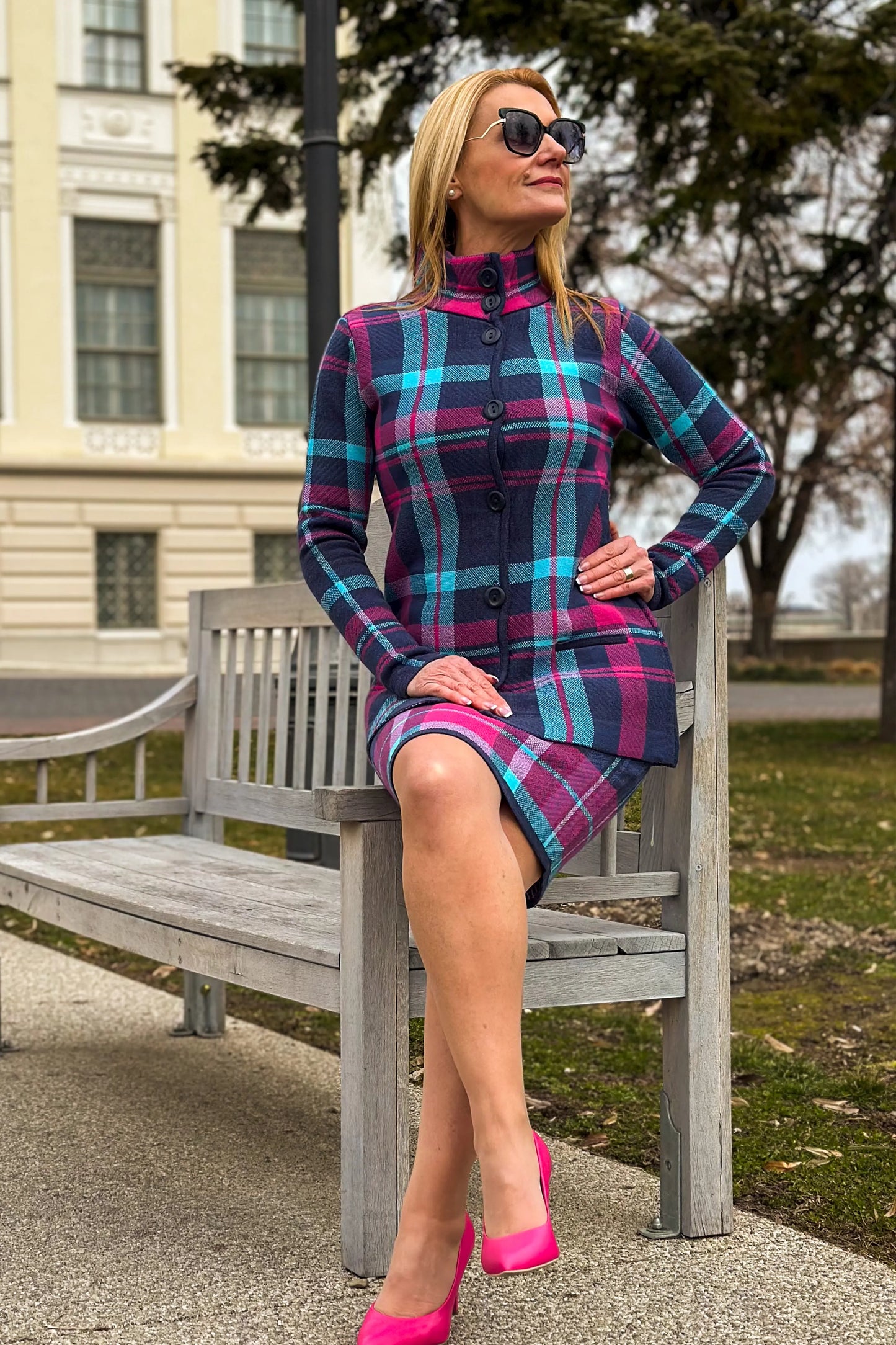 Fashionable short plaid coat with a buttoned front, perfect for spring.