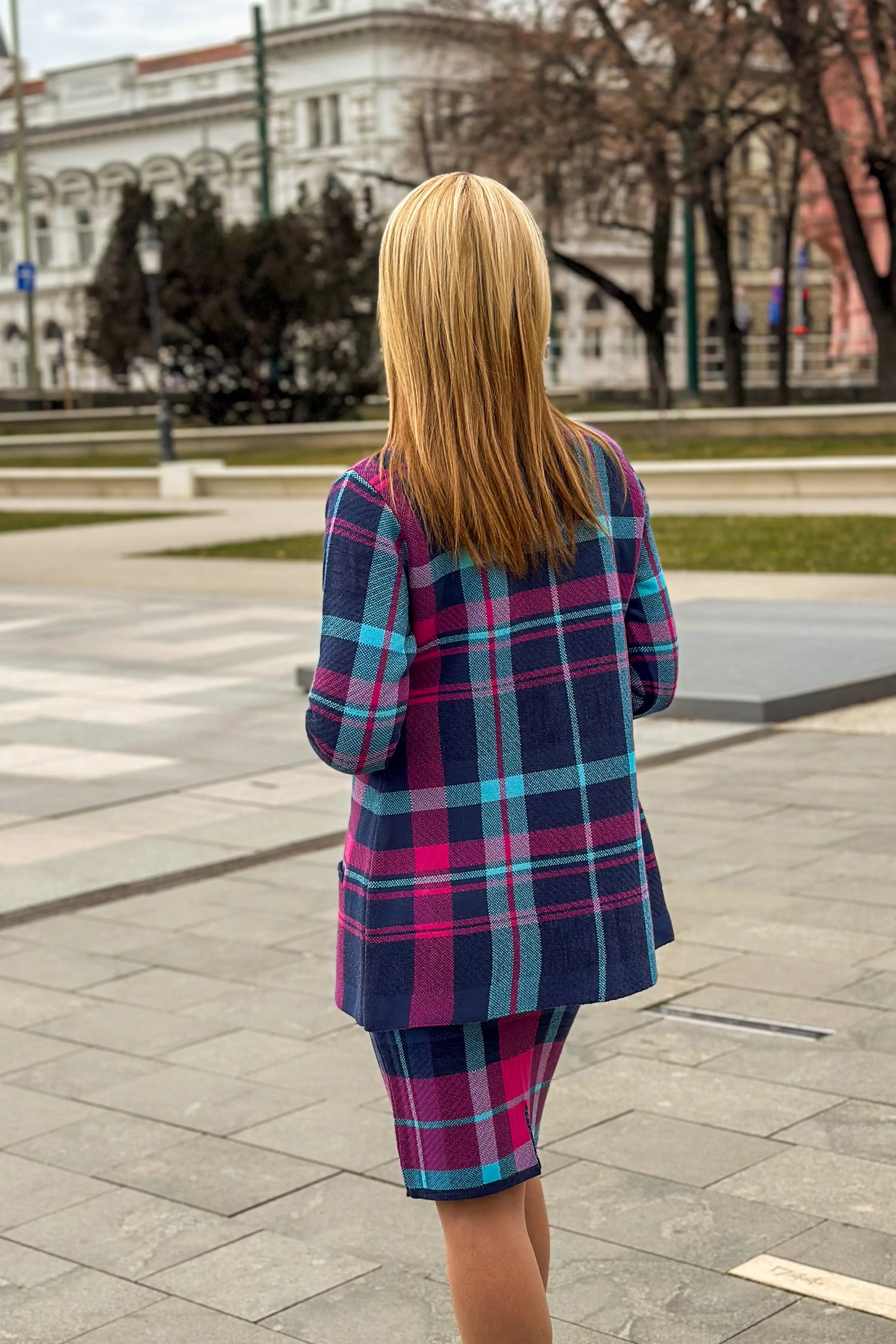 Timea High-Waisted Plaid Midi Skirt - Back view showing bold plaid pattern.